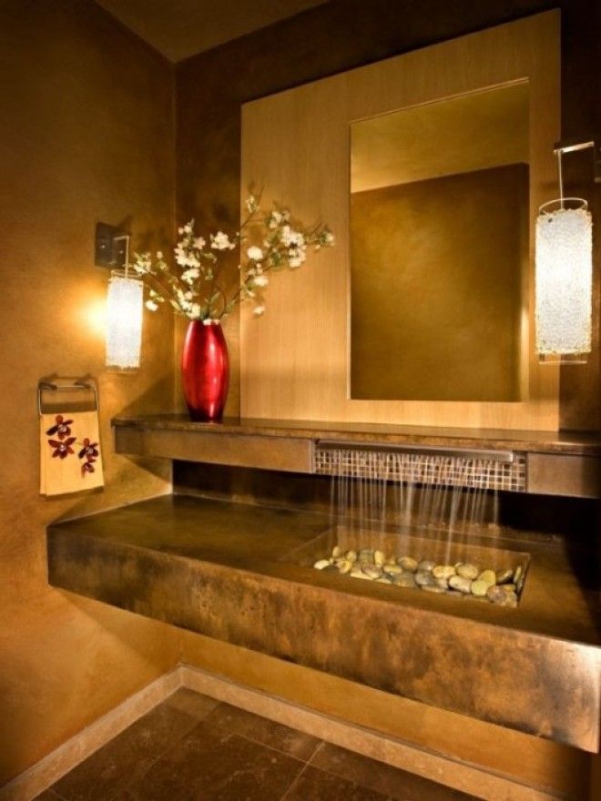 Конструкция раковиныводопада создаст яркий и неповторимый акцент в интерьере ванной