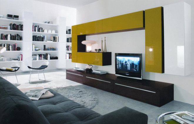 Современная модульная стенка в зоне для просмотра телевизора в минималистском стиле которая идеально подчёркивает уникальность интерьера гостиной комнаты 